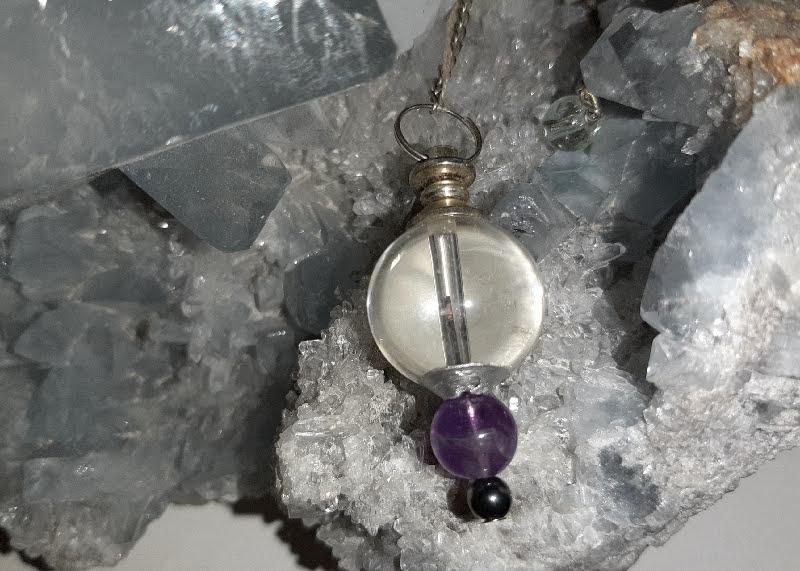 Pendule en cristal de roche et amethyste
