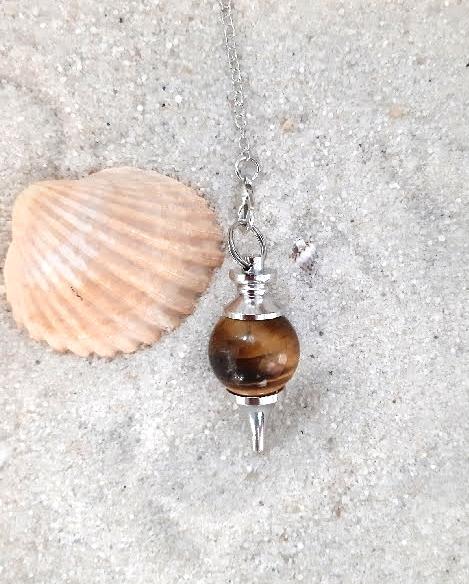 Pendule sphere oeildetigre missterreetciel